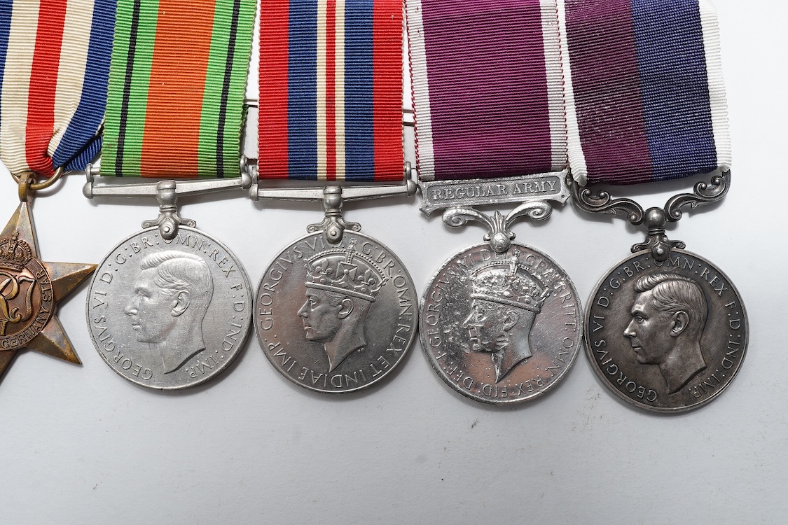A WWII medal group awarded to Sqdn. Ldr. J.M. Anderson. R.A.F., also engraved under the ranks of Private (7260344), and Flight Officer, comprising of seven medals (three engraved)